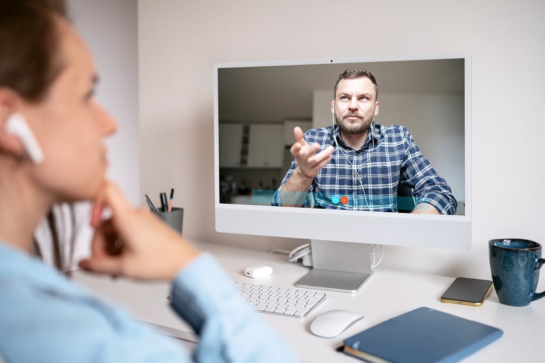 Man and woman talking during an online video call