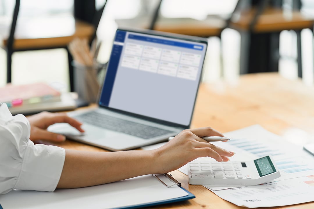 Woman analyzing marketing and sales data on a computer dashboard